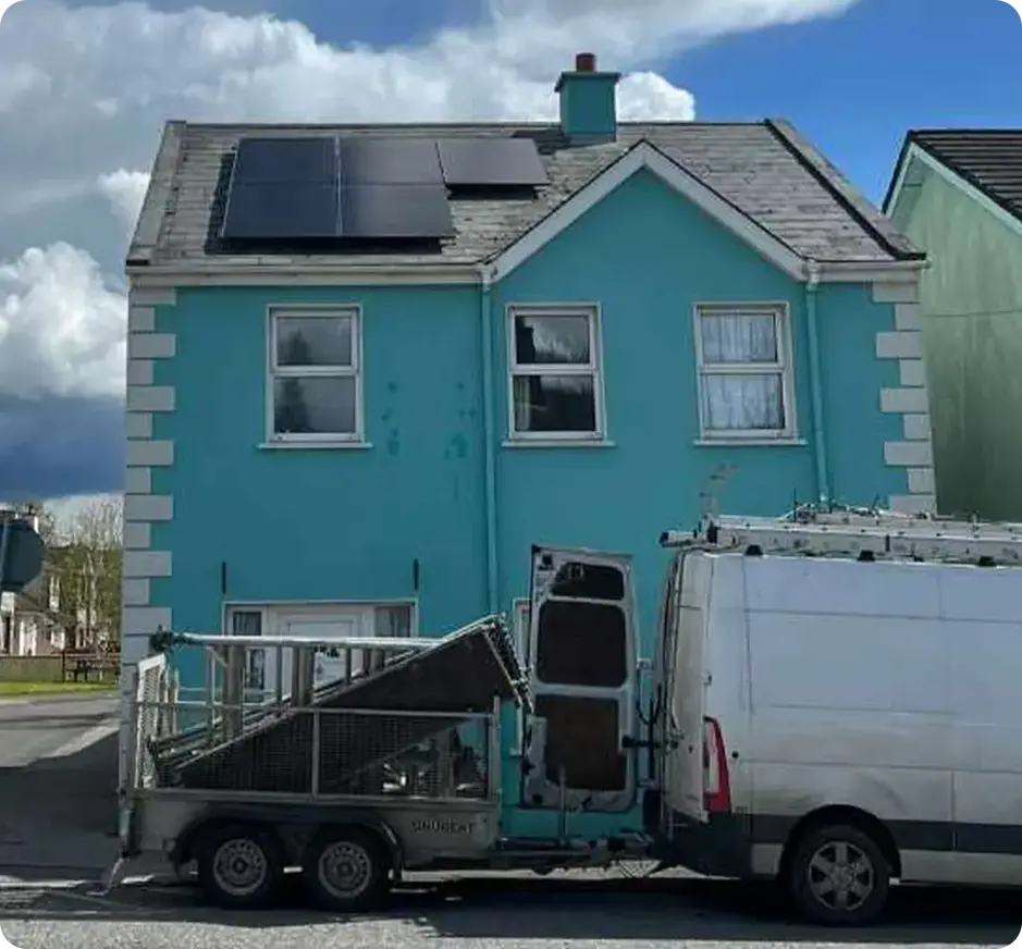 House with solar panels and van