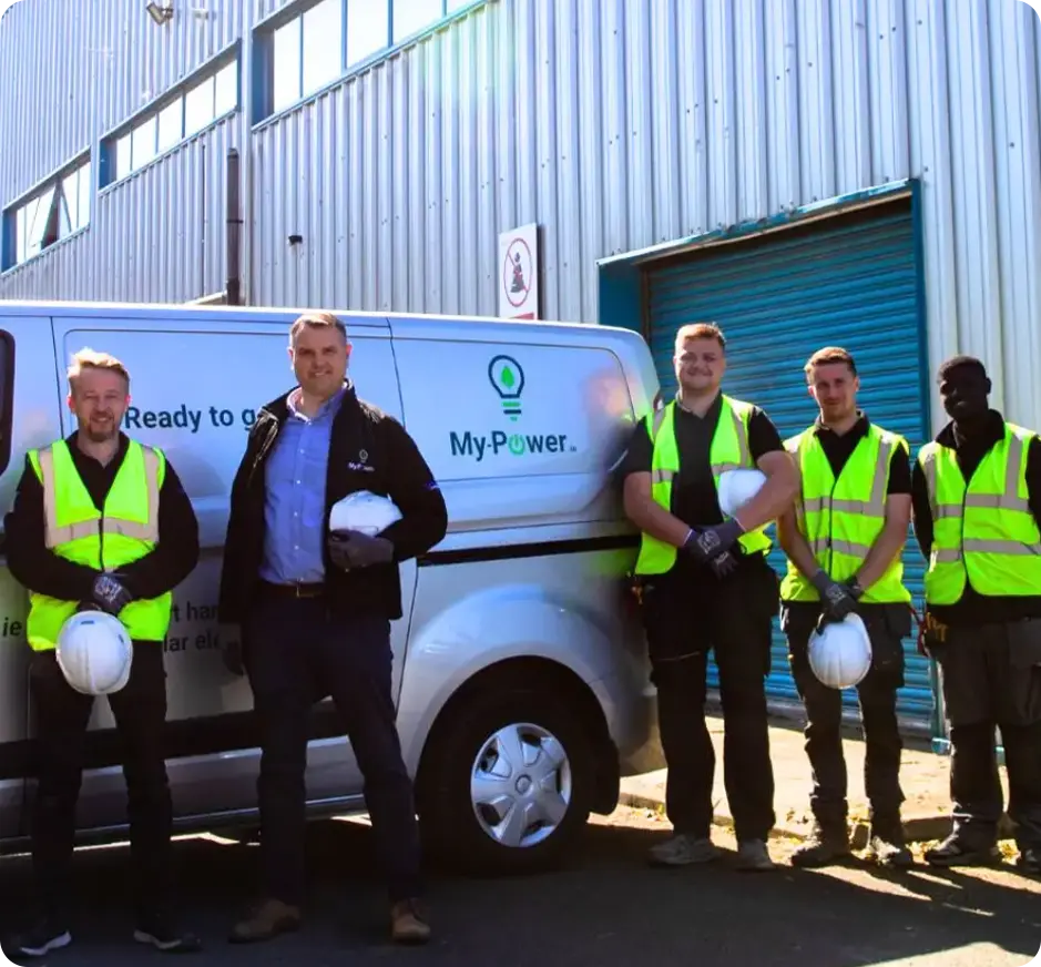 Workers in safety vests by van.